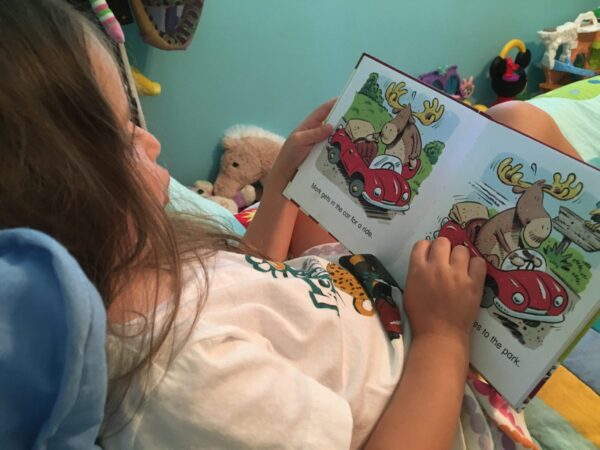 preschooler reading on her own